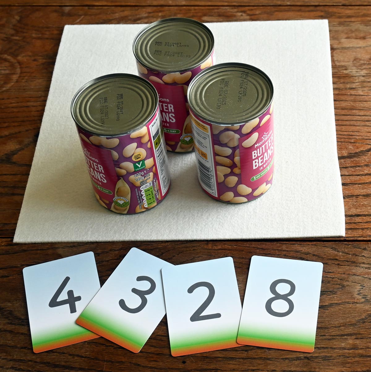 Three tins and various number cards