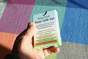 Usk box of cards held in the hand